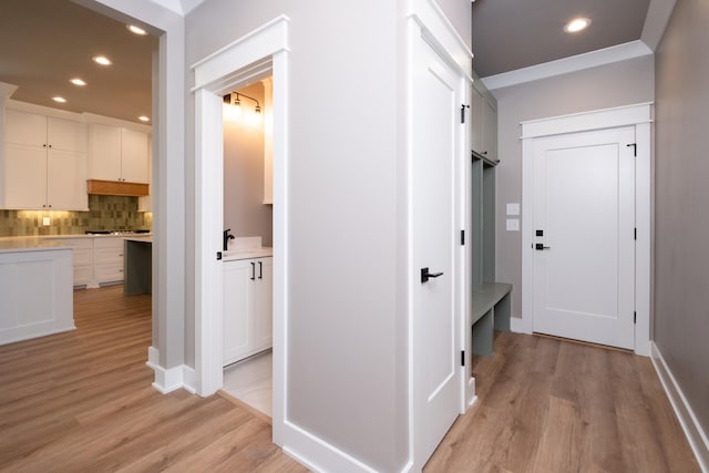 corridor featuring light hardwood / wood-style floors