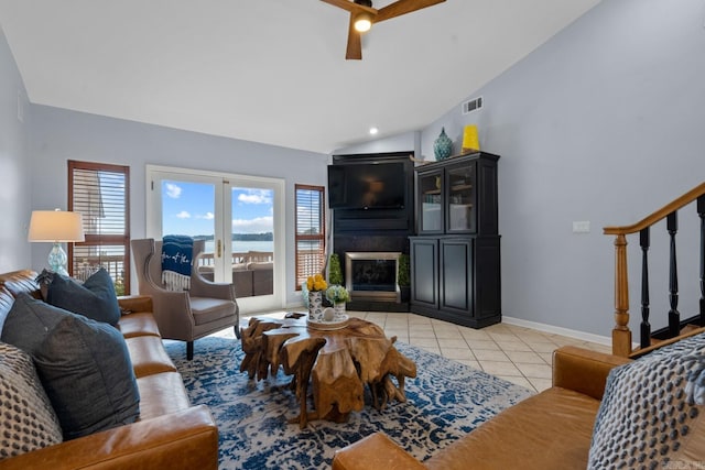 living room featuring light tile patterned floors and lofted ceiling