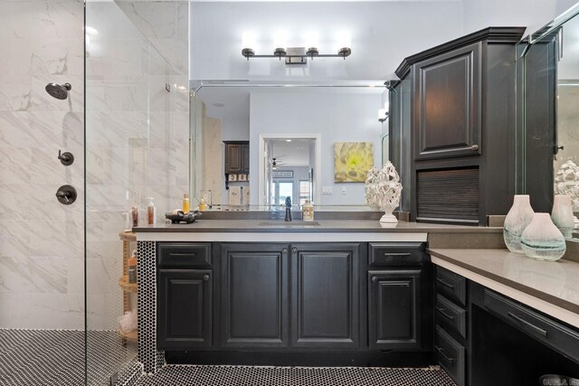 bathroom with an enclosed shower and vanity