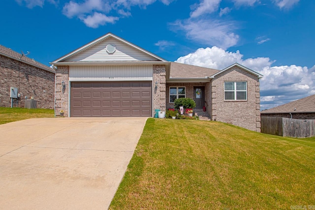 ranch-style home featuring a garage, central air condition unit, and a front lawn