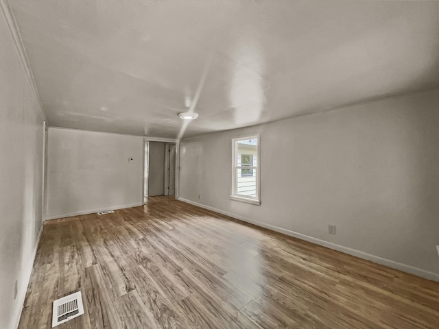 empty room featuring hardwood / wood-style floors