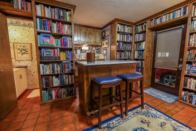 tiled home office with a textured ceiling