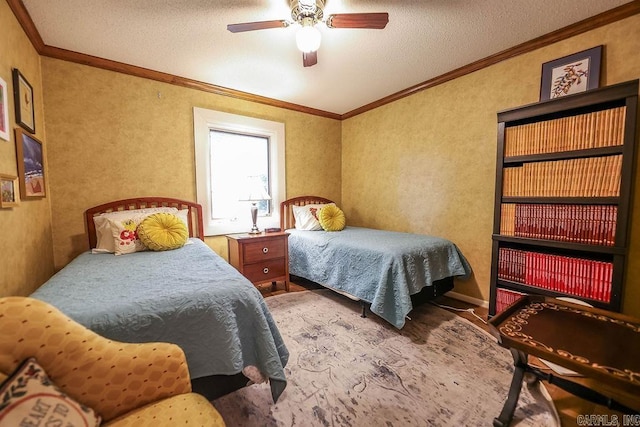 bedroom featuring a textured ceiling, crown molding, and ceiling fan