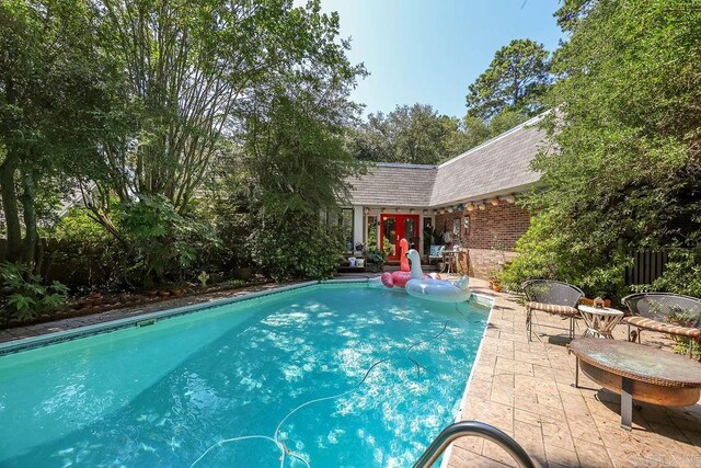 view of pool featuring a patio area