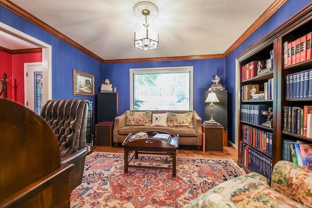 living area with a textured ceiling, an inviting chandelier, and ornamental molding