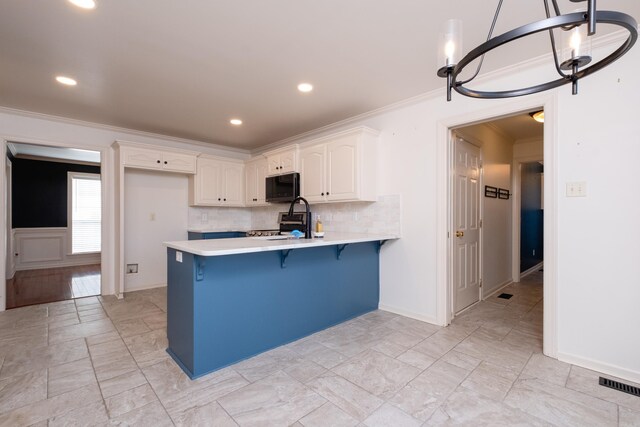 interior space featuring built in shelves, dark wood-type flooring, ceiling fan, and ornamental molding