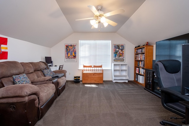 carpeted office space with ceiling fan and vaulted ceiling