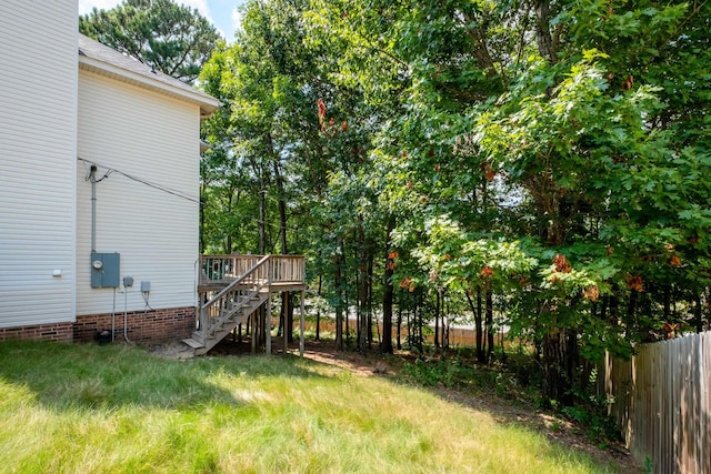 view of yard featuring a wooden deck