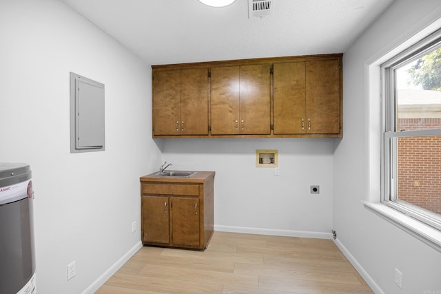 clothes washing area featuring hookup for an electric dryer, washer hookup, visible vents, cabinet space, and electric panel