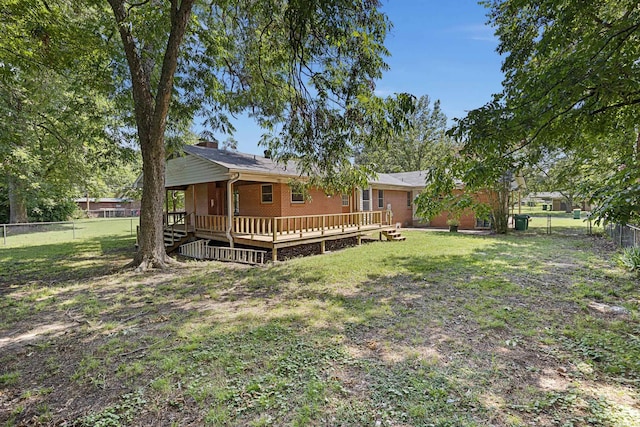 view of yard with a fenced backyard and a deck