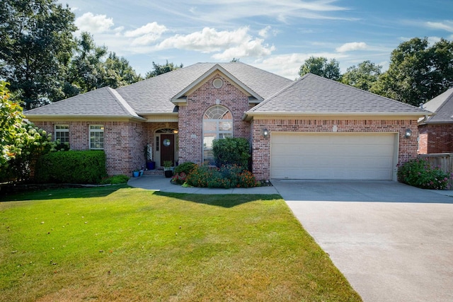 ranch-style home with a front yard and a garage