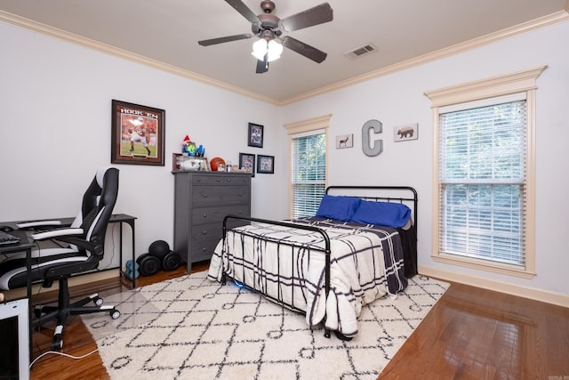 bedroom featuring multiple windows and light hardwood / wood-style floors