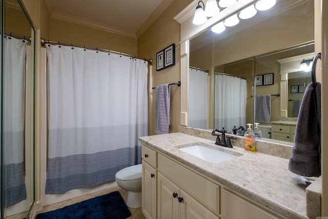 bathroom featuring vanity, crown molding, toilet, and tile patterned flooring