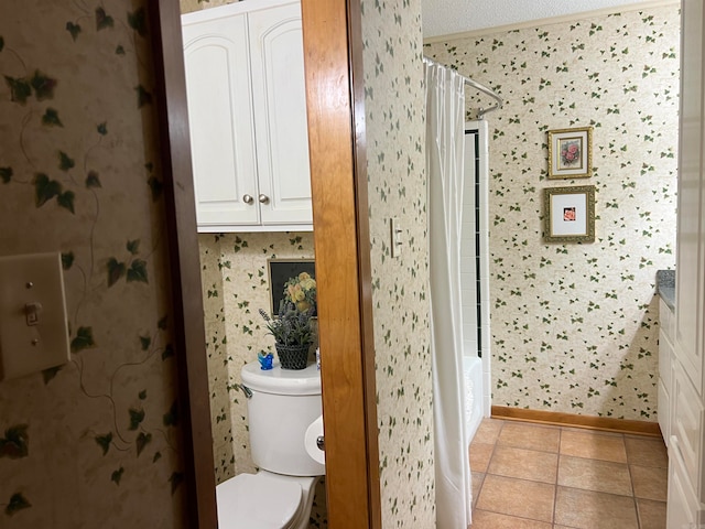 bathroom featuring toilet, tile patterned floors, and vanity