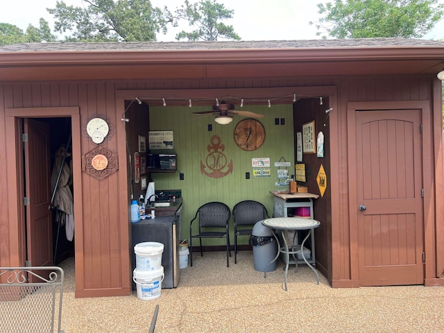 exterior space with sink and ceiling fan