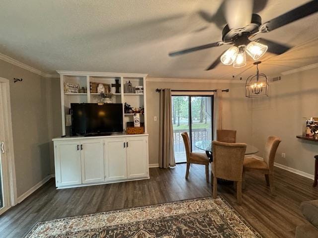 unfurnished dining area with ornamental molding, dark hardwood / wood-style flooring, and ceiling fan with notable chandelier