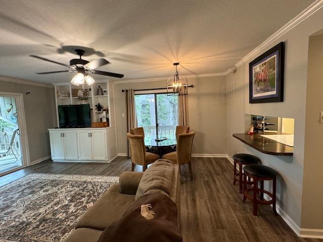 dining space with crown molding and dark hardwood / wood-style floors