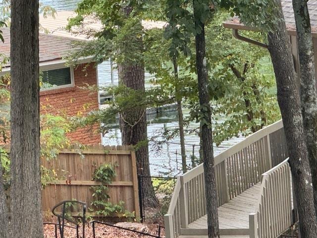 wooden deck with a water view