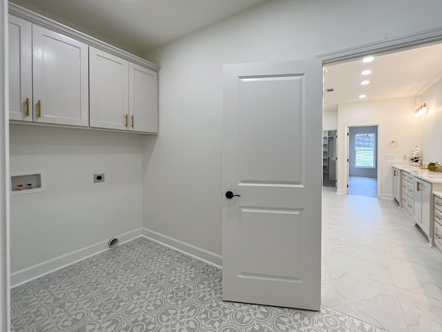 laundry area with hookup for a washing machine, cabinets, and hookup for an electric dryer