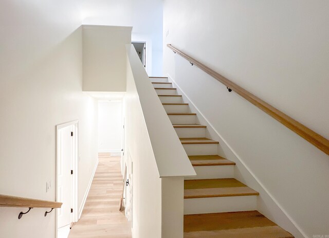 staircase featuring hardwood / wood-style floors