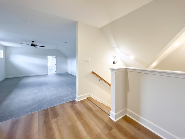 bonus room with hardwood / wood-style flooring, ceiling fan, and lofted ceiling