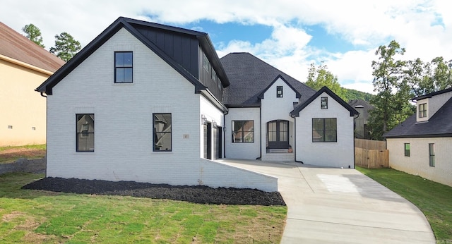 view of front of home with a front lawn