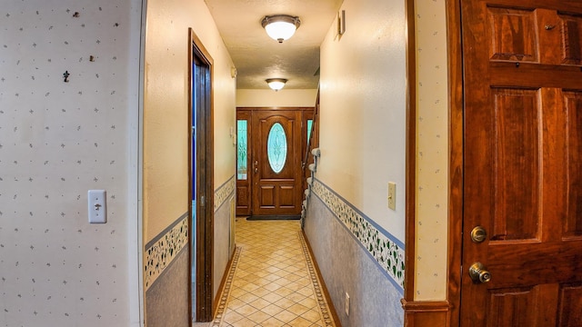 doorway to outside featuring light tile patterned floors