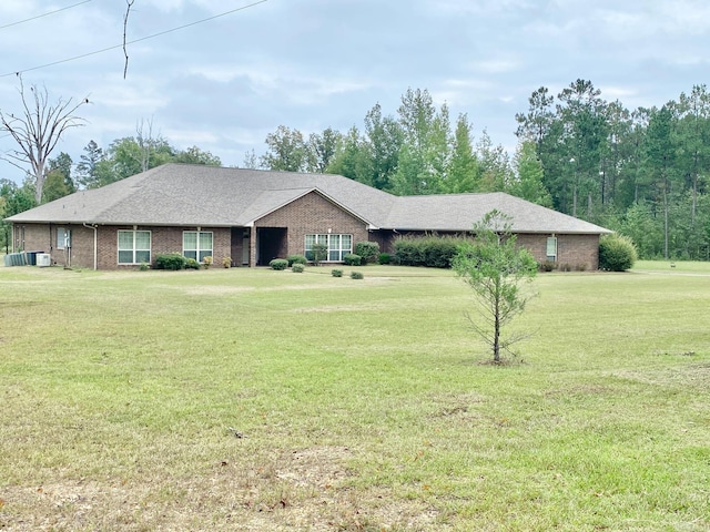 ranch-style house with a front lawn