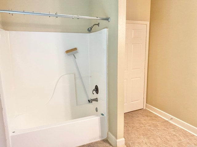 bathroom featuring shower / bath combination and tile patterned flooring