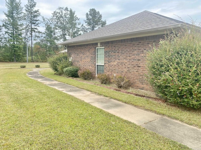 view of property exterior with a lawn