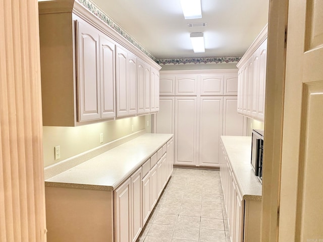 interior space featuring light tile patterned flooring