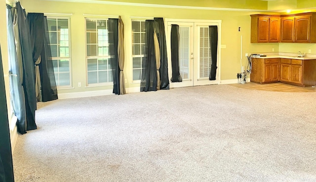 living room with light carpet and french doors