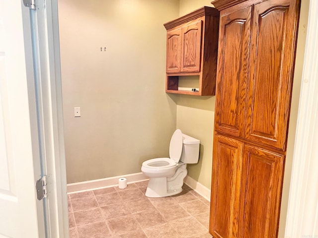 bathroom featuring tile patterned floors and toilet