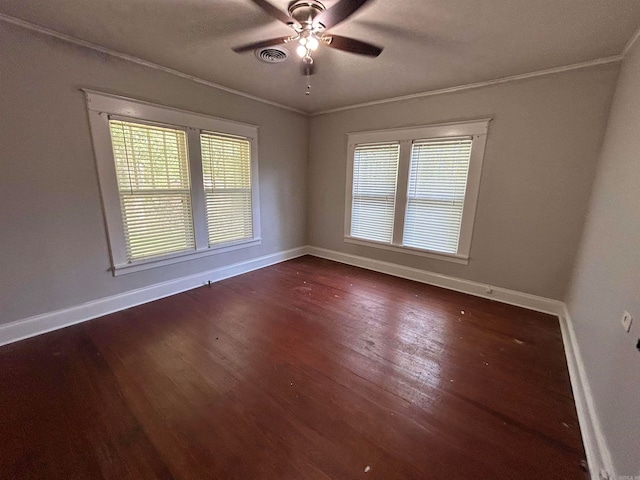 empty room featuring ceiling fan, hardwood / wood-style flooring, and ornamental molding