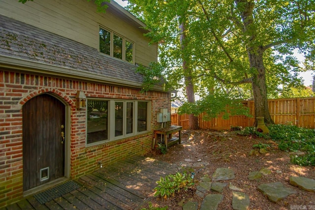 exterior space with fence and a deck