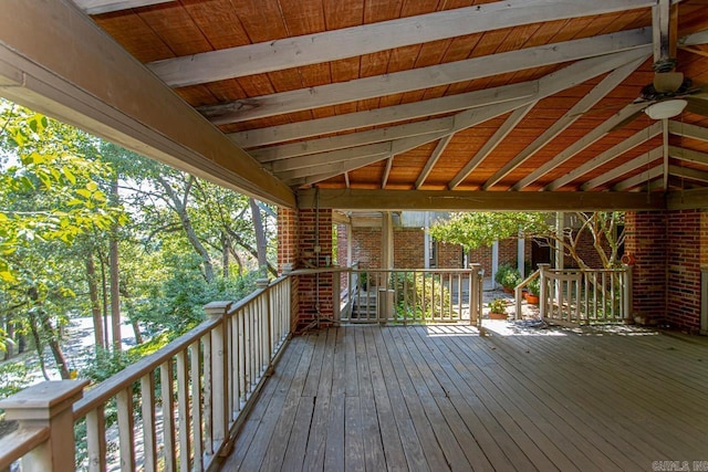 wooden deck featuring ceiling fan