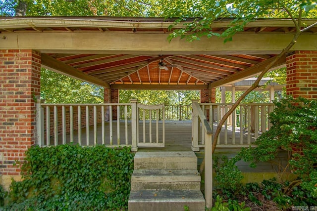 wooden terrace featuring a gazebo