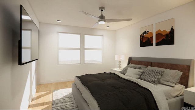 bedroom with ceiling fan and light hardwood / wood-style flooring