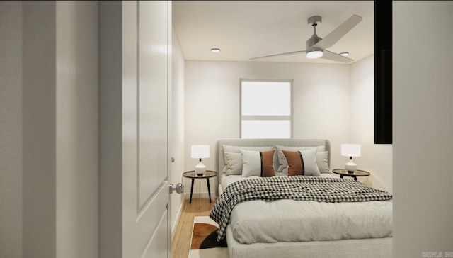 bedroom with ceiling fan and wood-type flooring