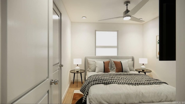 bedroom with ceiling fan and wood-type flooring