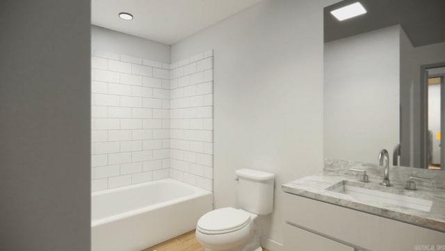 full bathroom featuring toilet, tiled shower / bath combo, vanity, and hardwood / wood-style flooring