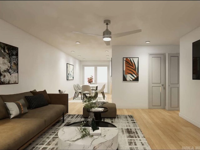 living room featuring light wood-type flooring and ceiling fan