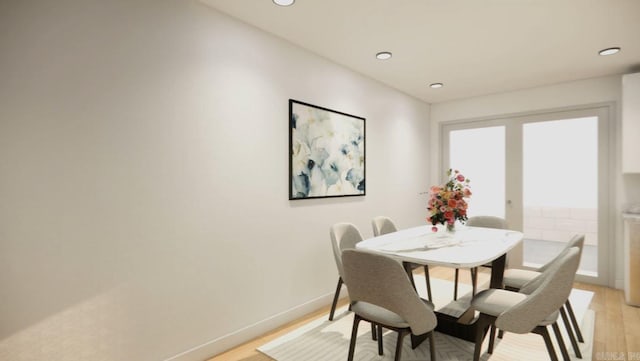 dining area with light hardwood / wood-style flooring