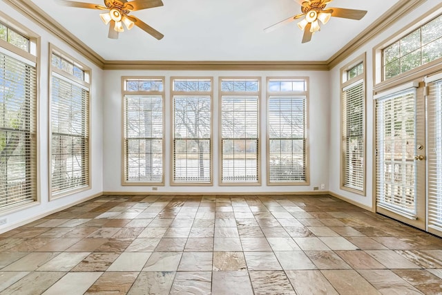 unfurnished sunroom featuring ceiling fan and plenty of natural light