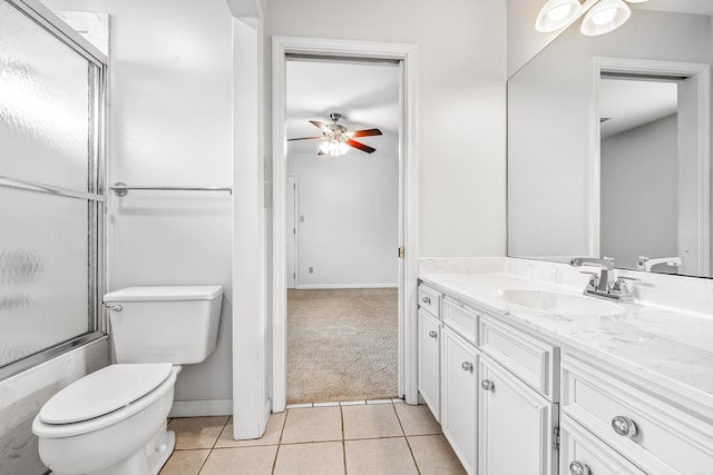 full bath featuring a ceiling fan, toilet, tile patterned flooring, combined bath / shower with glass door, and vanity