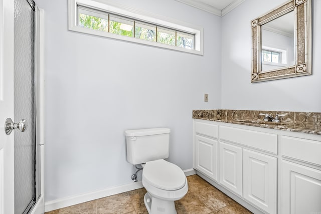 bathroom featuring a shower with door, toilet, ornamental molding, vanity, and baseboards