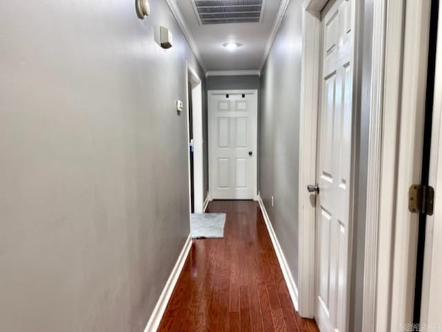 hall with crown molding and dark hardwood / wood-style floors