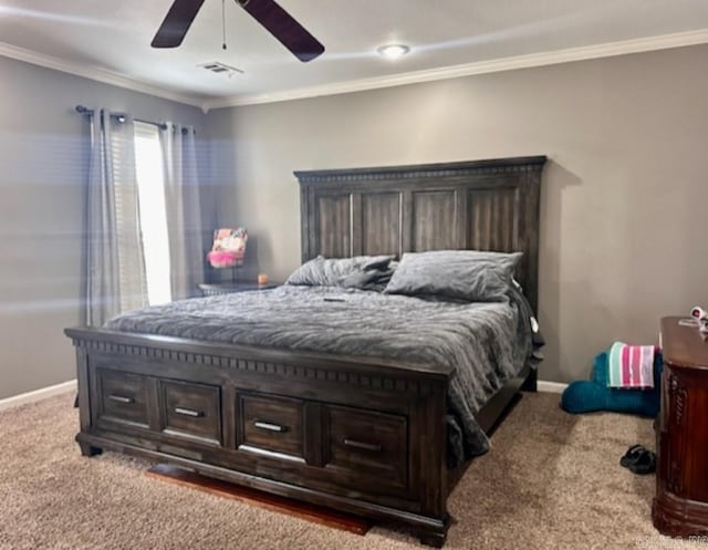 bedroom featuring ceiling fan, carpet floors, and crown molding