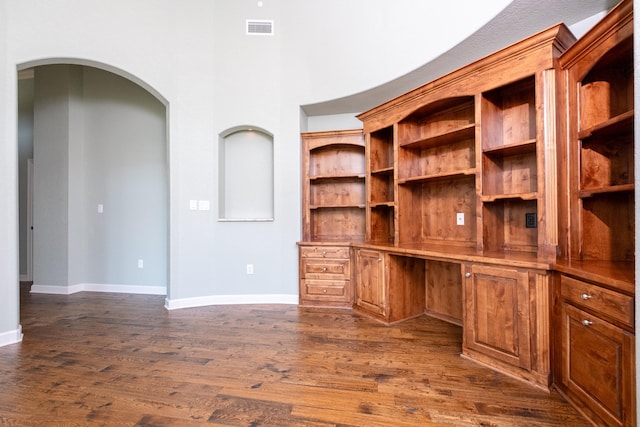 unfurnished office featuring dark hardwood / wood-style flooring