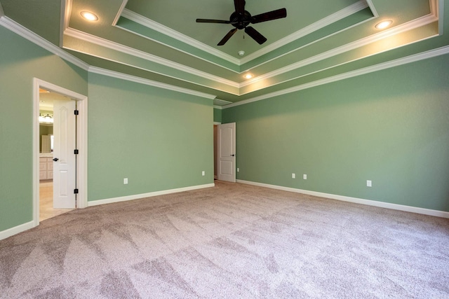 interior space featuring crown molding, a raised ceiling, and ceiling fan